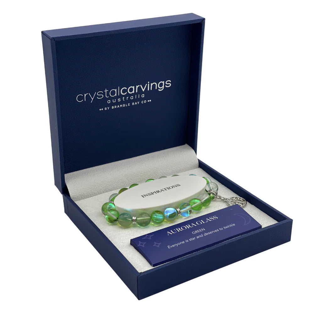 Green beaded bracelet in a 'Crystal Carvings Australia' box on a white background