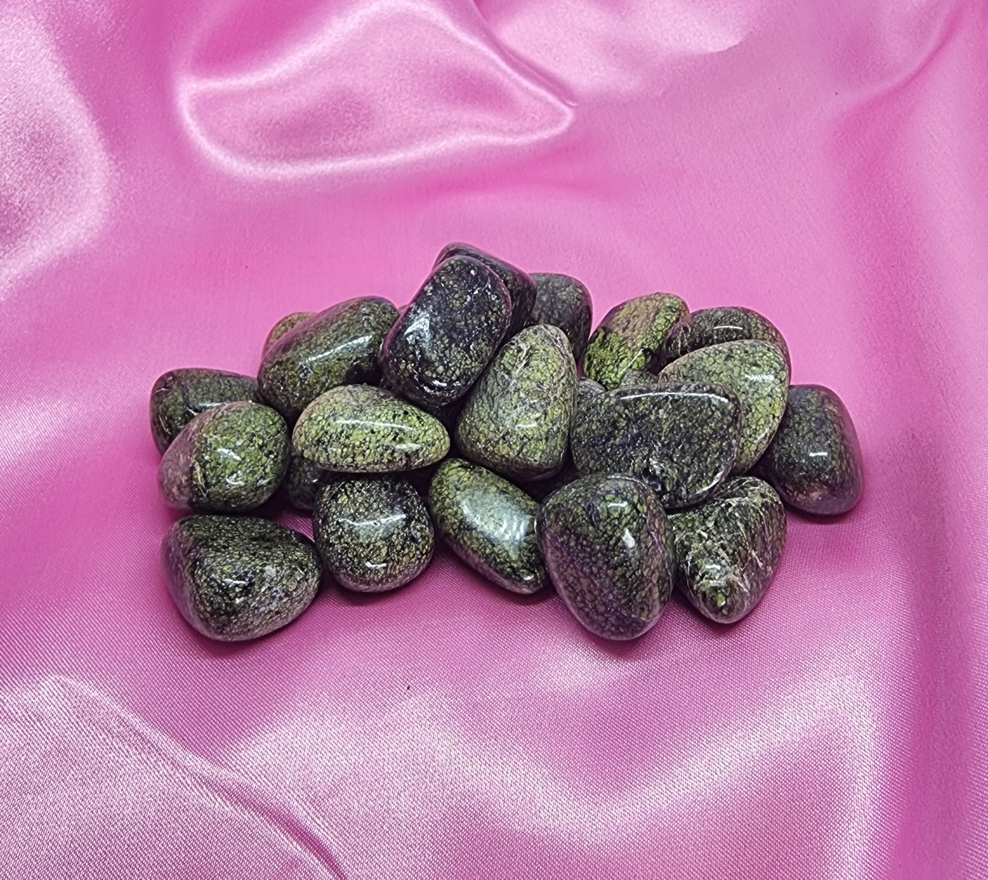 Serpentine tumbles at crystal shop near Sydney. Green crystals.