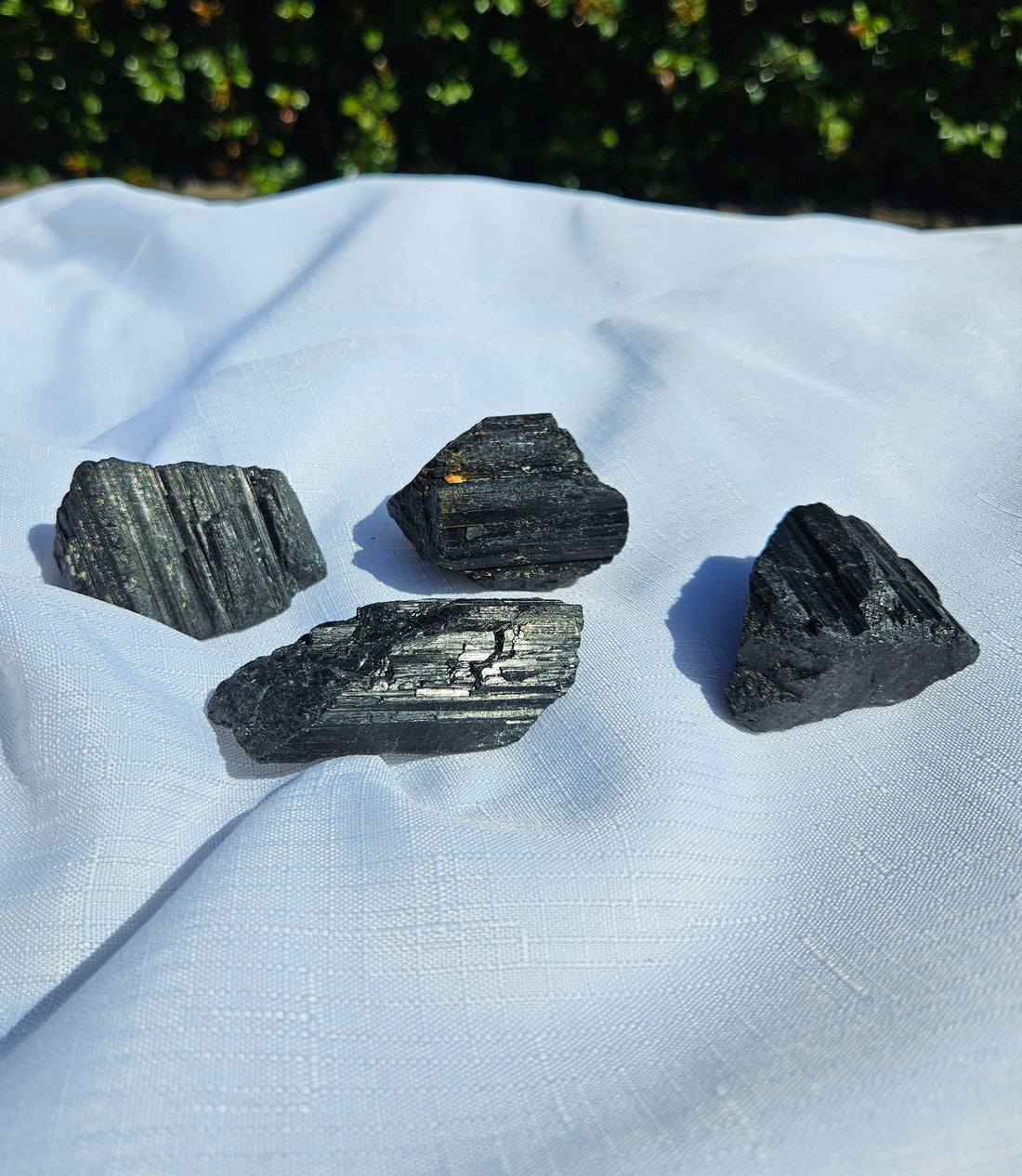 Best crystals to use in meditation, black tourmaline crystal, clear quartz, blue kyanite.