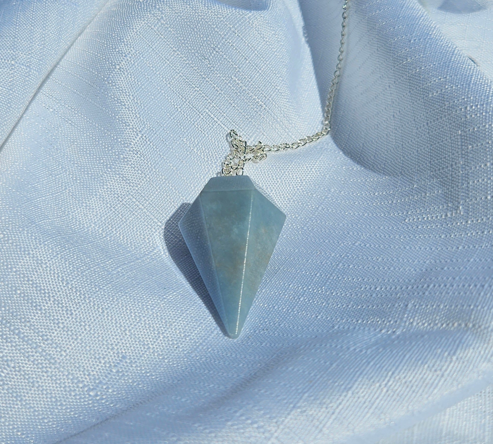 Angelite pendulum crystal for psychic readings at crystal shop in australia.
