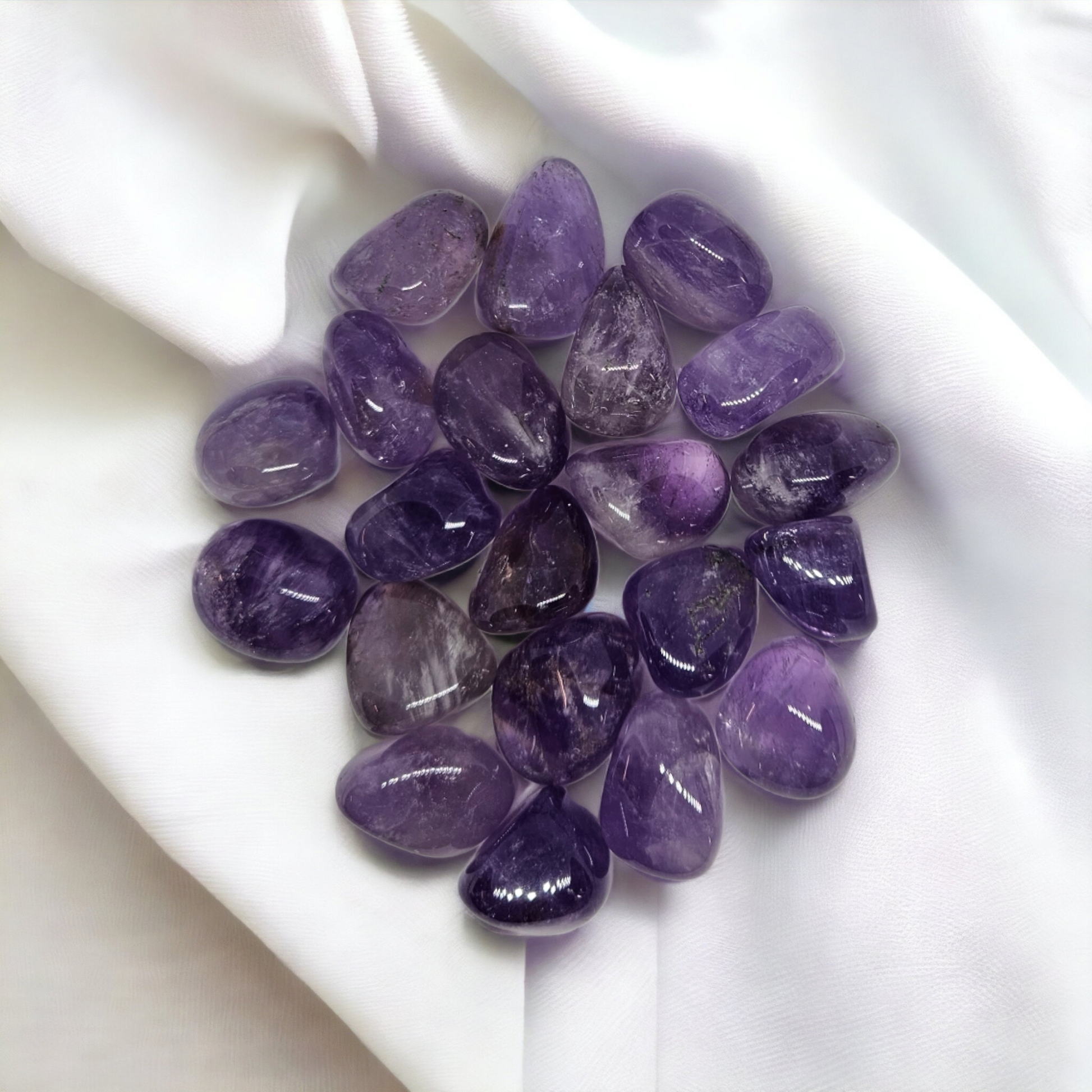 Amethyst crystal tumbles, sold at Mind Soul Sync crystal shop near Sydney Australia. Purple crystal.